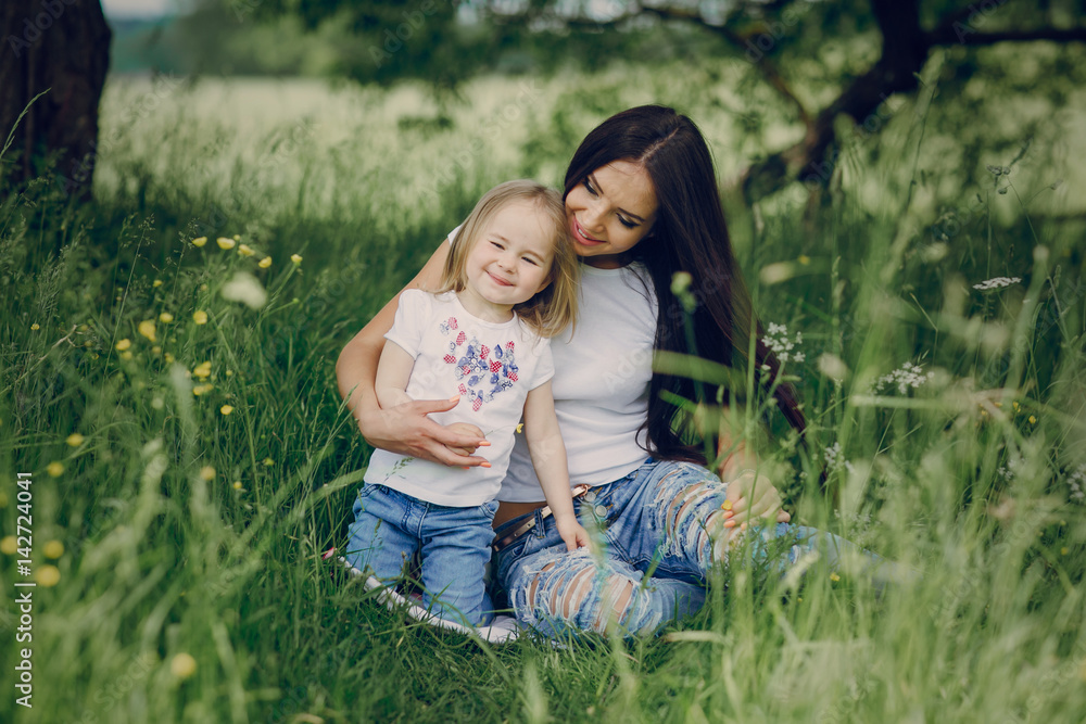 Fototapeta premium child near tree with mom