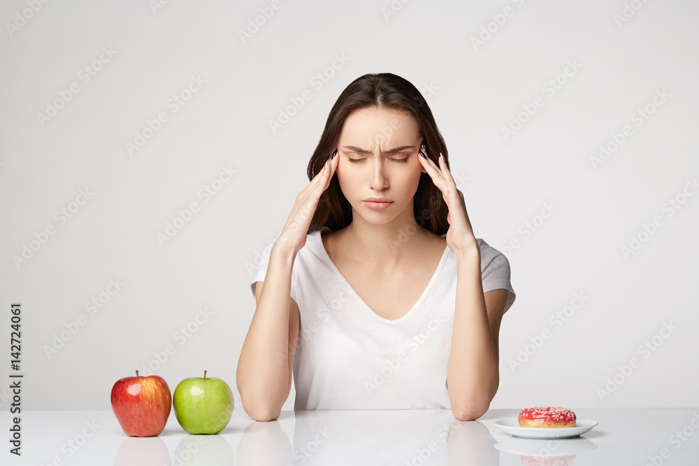 woman beauty girl with fruits and donut apple on gray white background woman beauty girl with fruits and donut apple on gray white background