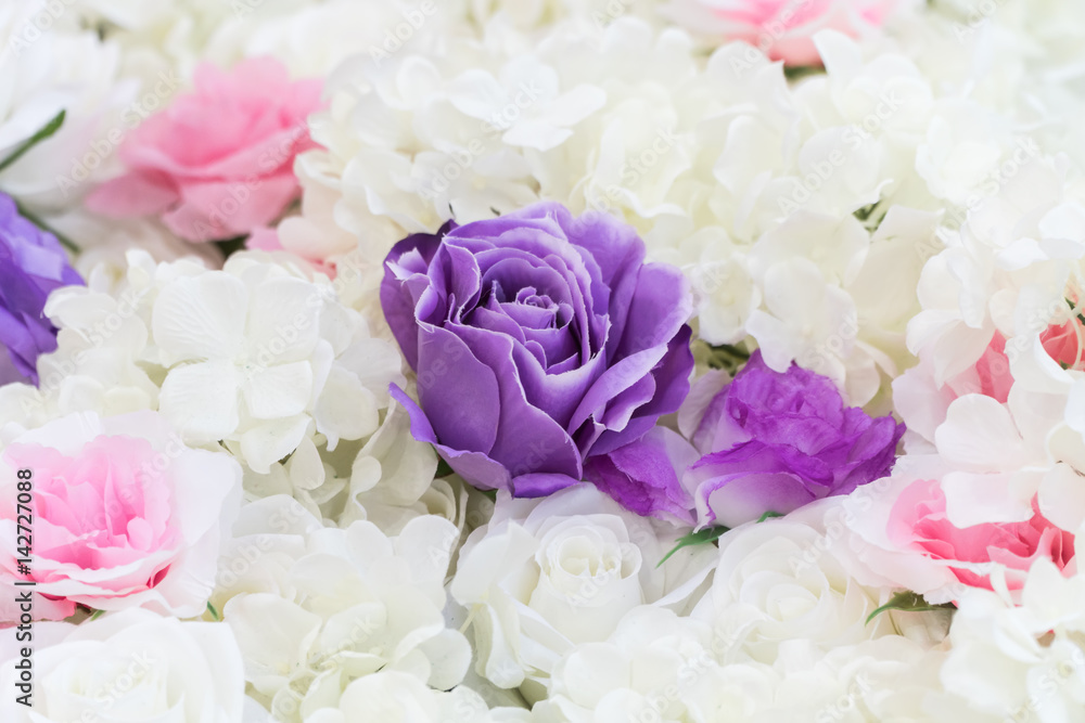 Purple roses in a wedding arrangement Purple roses in a wedding arrangement