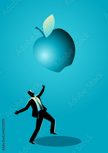 Businessman receiving a fallen big apple