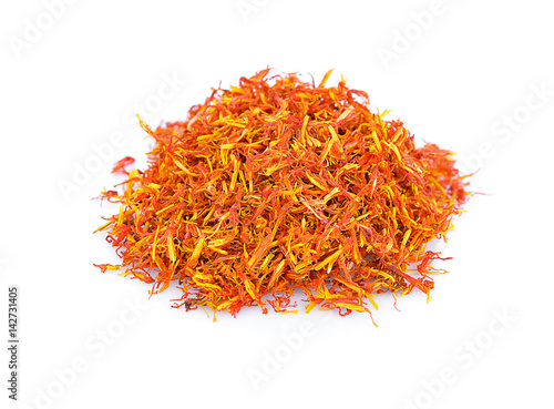 Safflower petals heap on white background.