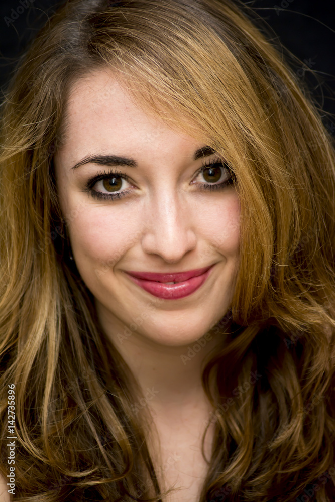Beauty Woman Portrait over Black Background