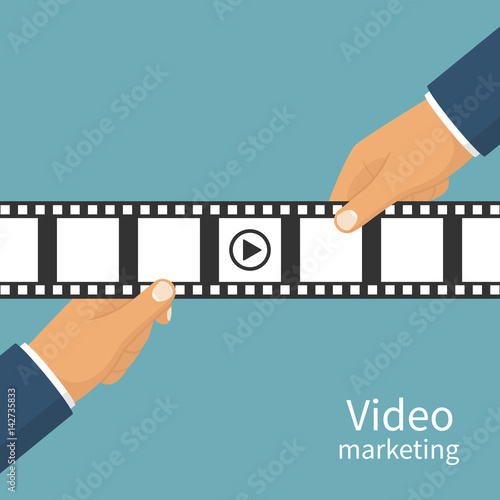 Video marketing concept. Video filming isolated. Movie time. Presentation advertise, blogging, share content. Coming soon. Holding a negative film in hand. Vector flat design. Isolated background.