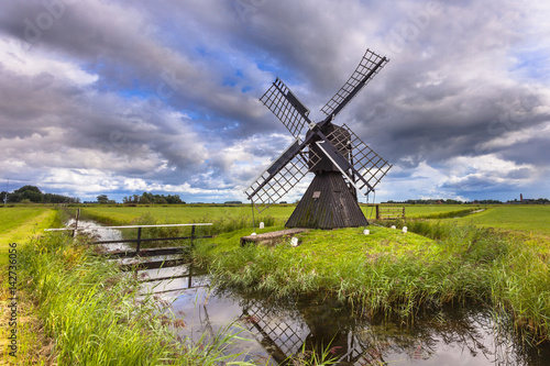 Historic Wooden Windmill photo