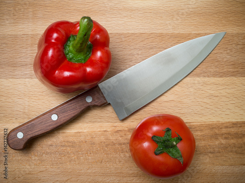 Knife, bell pepper, cucumber, tomato