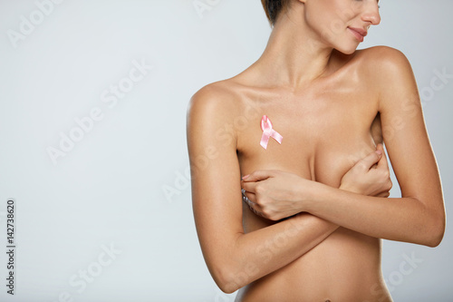Naked Woman With Breast Cancer Awareness Ribbon On Chest