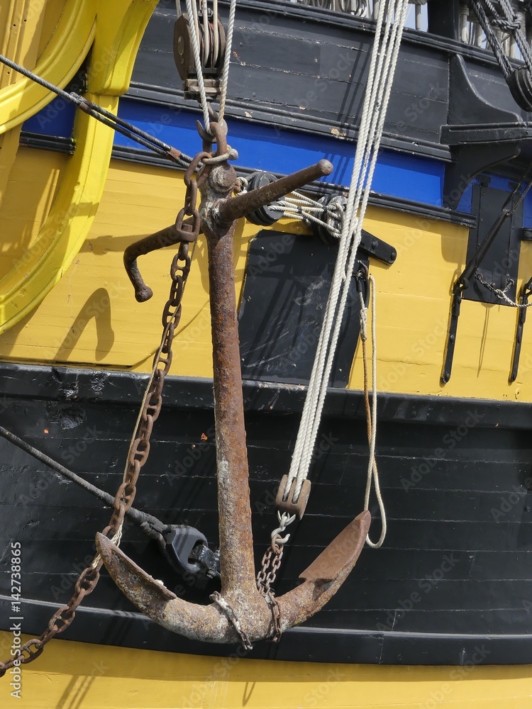 Details of anchor arrangements and pulley block on old wooden sailing ship. Saint-Malo, Brittany, France