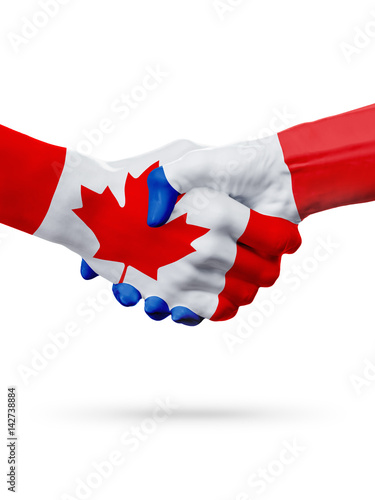 Flags Canada, France countries, partnership friendship handshake concept.