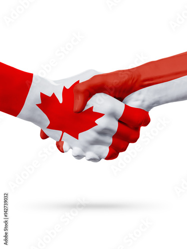 Flags Canada, Monaco countries, partnership friendship handshake concept.