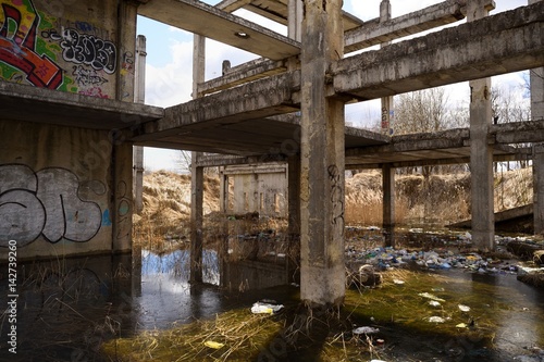 Abandoned Soviet concrete construction flooded with water