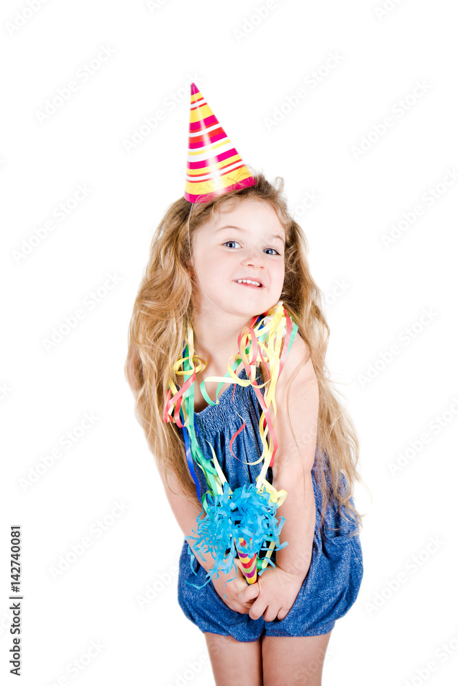 five-year-old girl with party hat and confetti five-year-old girl with party hat and confetti