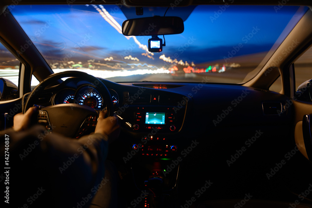 Night road view from inside car natural light street and other cars is motion blurred Night road view from inside car natural light street and other cars is motion blurred