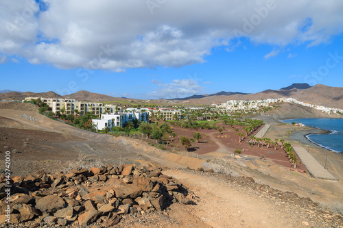 View of beach and bay with traditional white houses in village of Las Playitas  Fuerteventura  Canary Islands  Spain