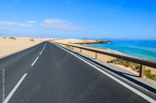 Road in desert landscape of sand dunes in Corralejo National Park  Fuerteventura  Canary Islands  Spain