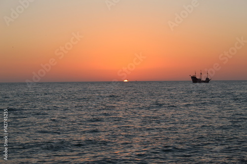pirates on the gulf at sunset