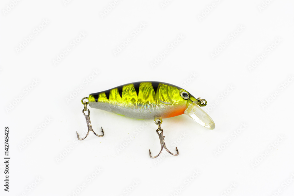 Exhibition of pirated copies of fishing metal spoon baits. Bait for fishing in the shape of a spoon with a hook on a white background Exhibition of pirated copies of fishing metal spoon baits. Bait for fishing in the shape of a spoon with a hook on a white background