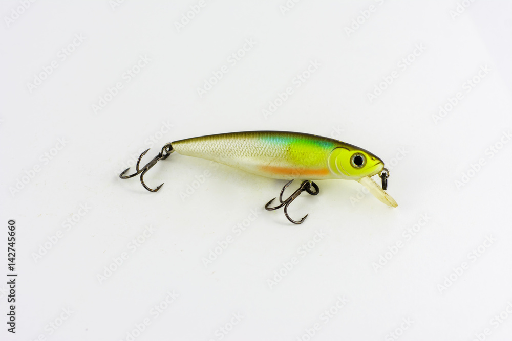 Exhibition of pirated copies of fishing metal spoon baits. Bait for fishing in the shape of a spoon with a hook on a white background Exhibition of pirated copies of fishing metal spoon baits. Bait for fishing in the shape of a spoon with a hook on a white background
