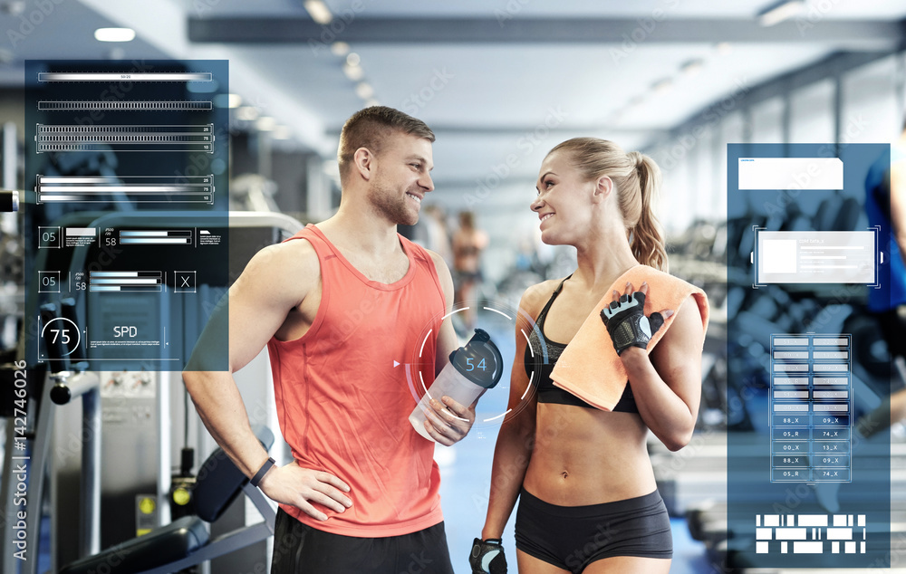 smiling man and woman talking in gym smiling man and woman talking in gym