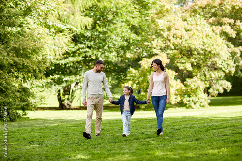 happy family walking in summer park