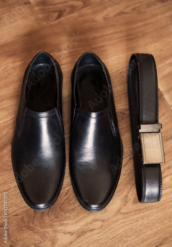 Mens set of black leather shoes and belt