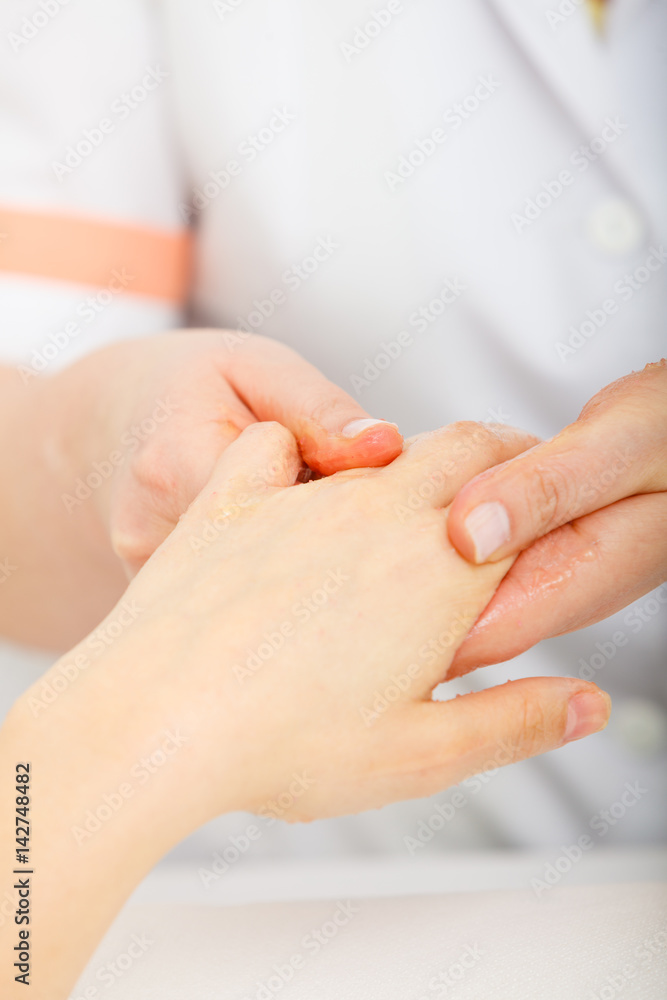 Woman getting hand massage at beauty salon Woman getting hand massage at beauty salon