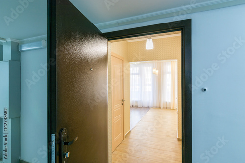 The open front door in renovated apartment in new building