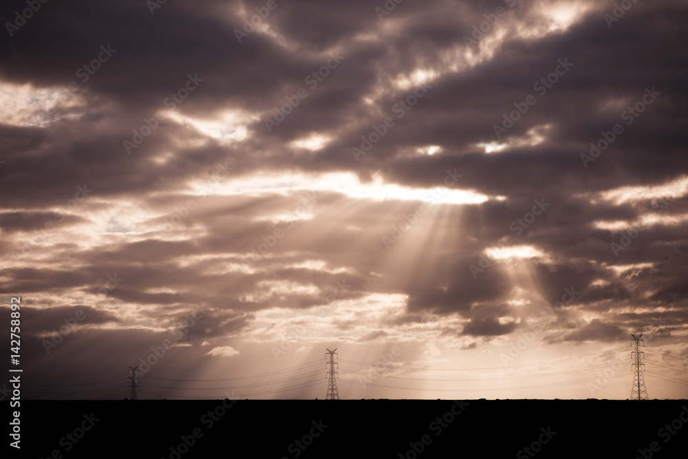 Fototapeta premium Sun Rays Shining Through Clouds Landscape