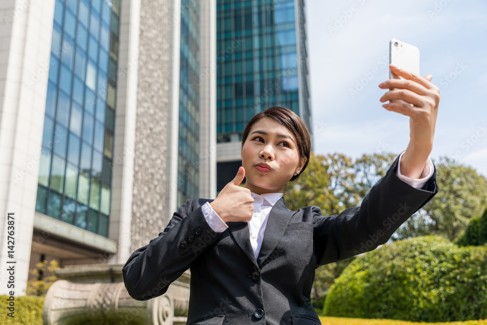 business woman taking selfie with smart phone business woman taking selfie with smart phone