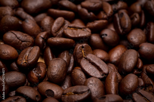 Organic coffee beans in background close up.