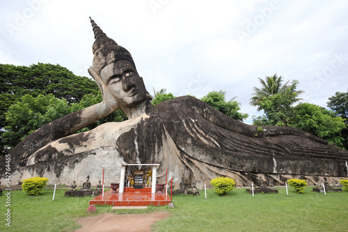 Reclining Buddha Statue in Wat Xieng Khuan Buddha park. photo