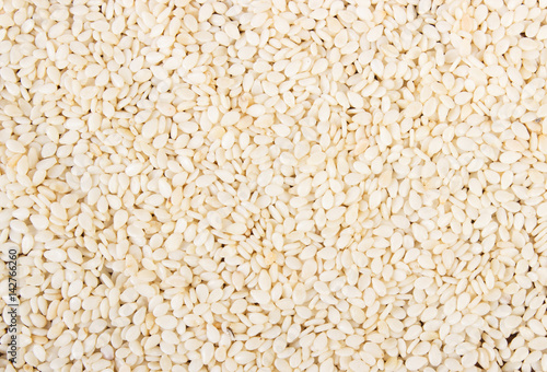 Sesame seeds as background, healthy nutrition concept
