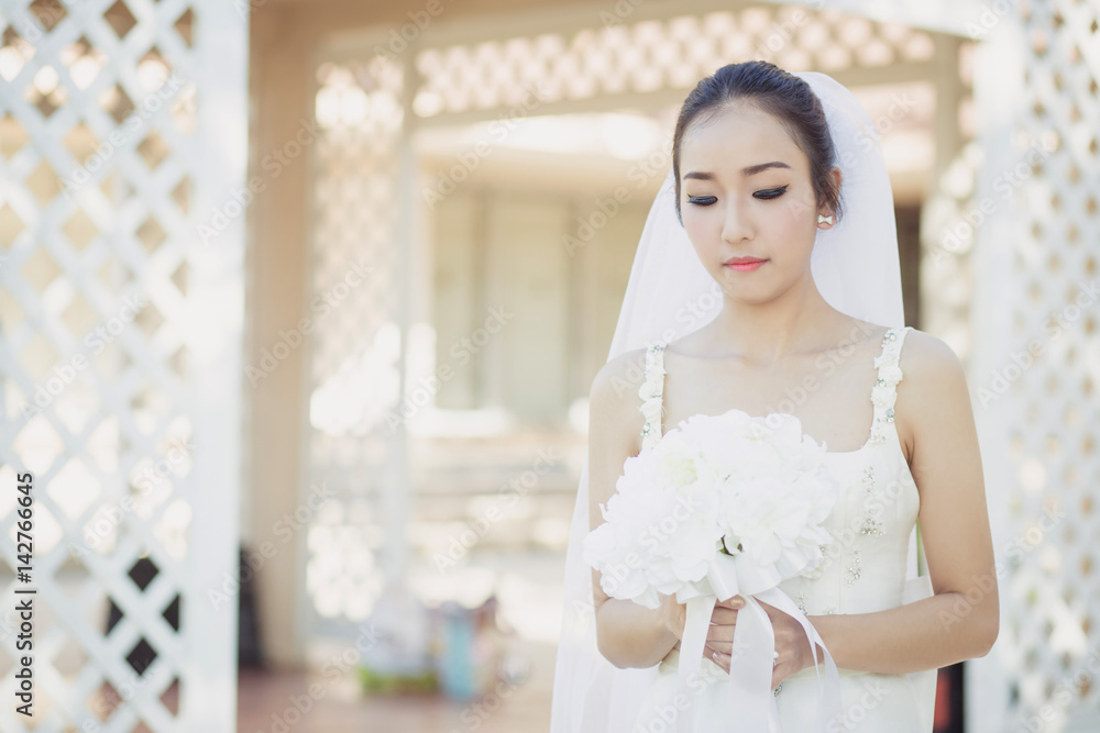 beautiful young woman on wedding day in white dress in the garden. Female portrait in the park. beautiful young woman on wedding day in white dress in the garden. Female portrait in the park.