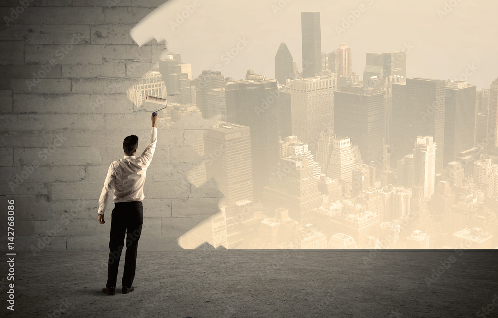 Salesman painting city scape on wall Salesman painting city scape on wall