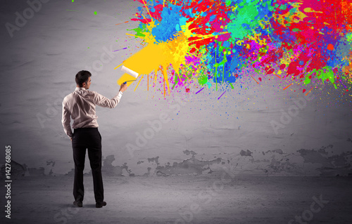 Sales person painting colorful splatter
