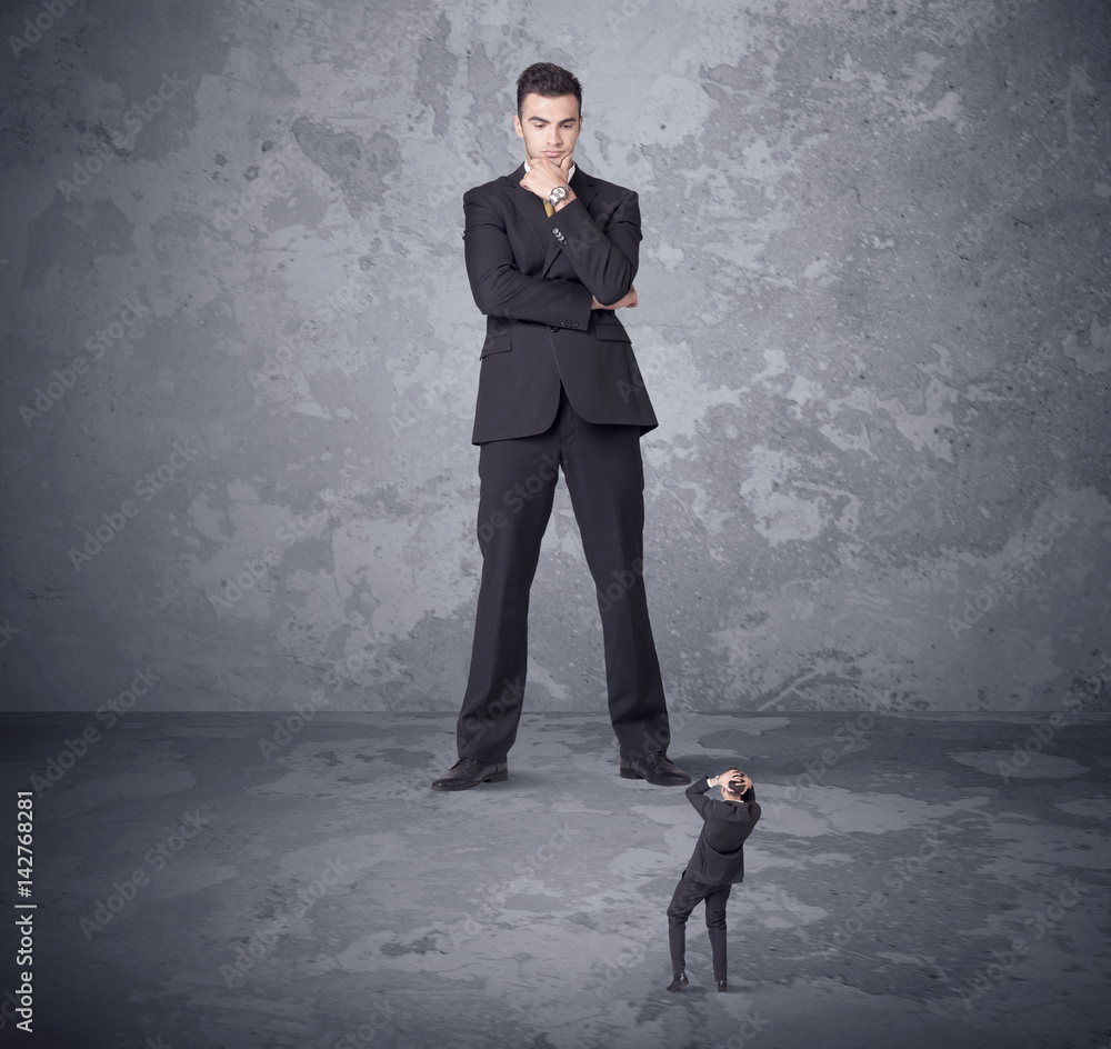 Fototapeta premium Big boss looking at tiny coworker