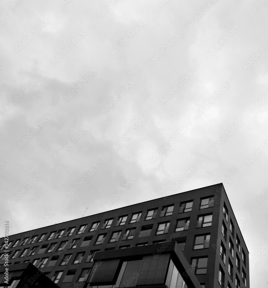 Low angle view of building exterior in monochrome Low angle view of building exterior in monochrome
