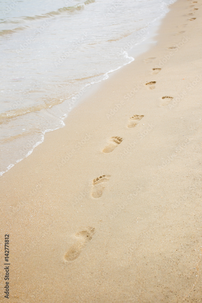 Foot print on sand at the beach background Foot print on sand at the beach background