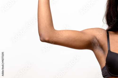 Underarm view of a muscular young woman
