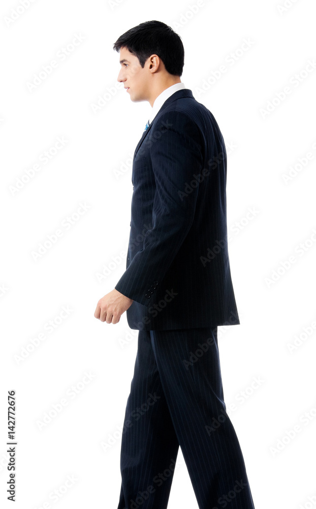 Full body of walking businessman, isolated