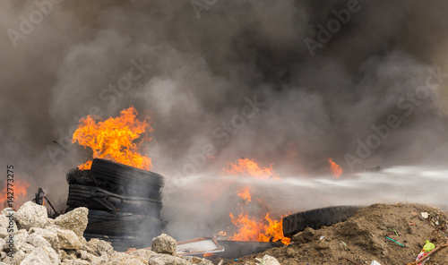 Wallpaper Mural Burning rubber tires creating big black smoke and pollution. Torontodigital.ca