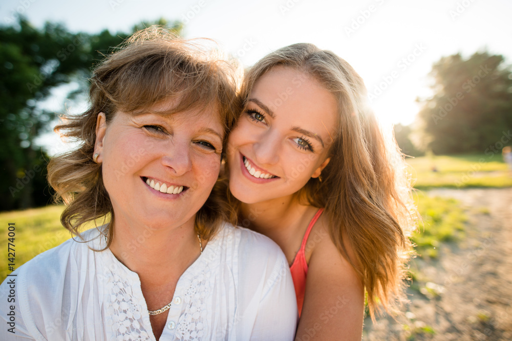 Mother and teenage daughter outdoor portrait Mother and teenage daughter outdoor portrait