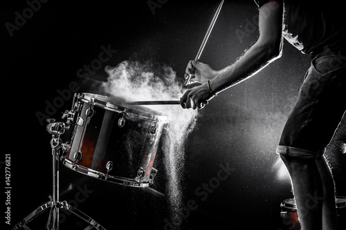 Quadro su tela man plays musical percussion instrument with sticks, a musical concept, beautifu