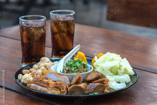 A delicious north thai food with soft drink.