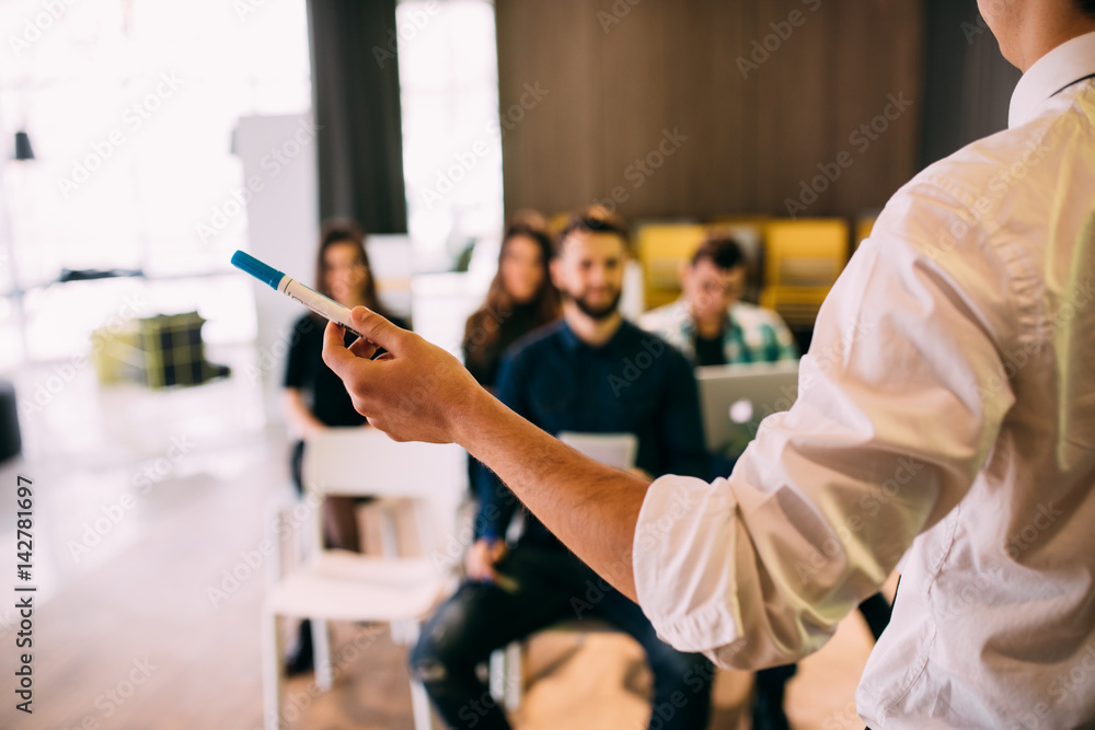 Lecture and training in business office for white collar colleagues. Focus  on hands of speaker. foto de Stock | Adobe Stock