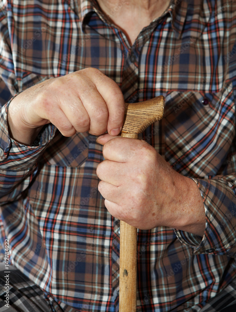 Old man hands with cane