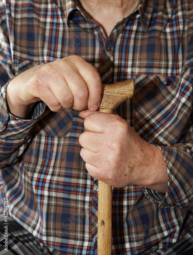 Old man hands with cane