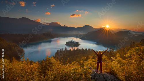 Girl with rising arms looking forward to a new day
