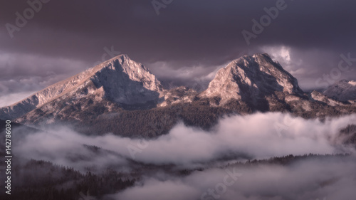 Idyllic mountain scenery at foggy dawn