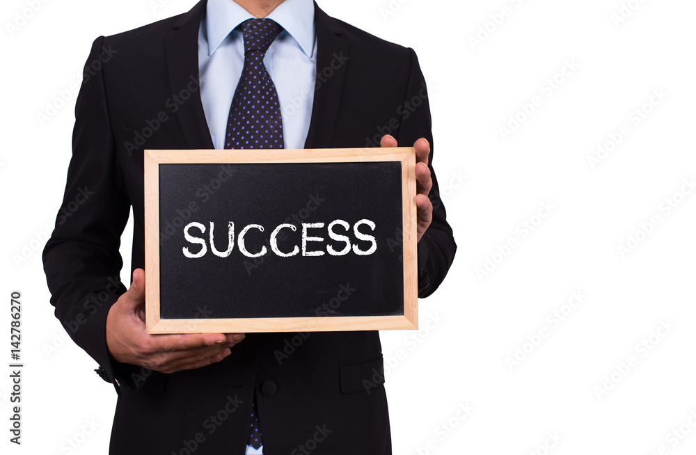 Businessman holding mini blackboard with SUCCESS message Businessman holding mini blackboard with SUCCESS message