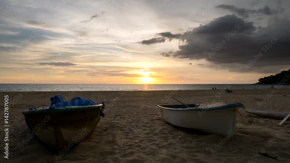 4K Time - lapse boat with movement cloud and sunset at karon bech , PHUKET THAILAND. 4K Time - lapse boat with movement cloud and sunset at karon bech , PHUKET THAILAND.